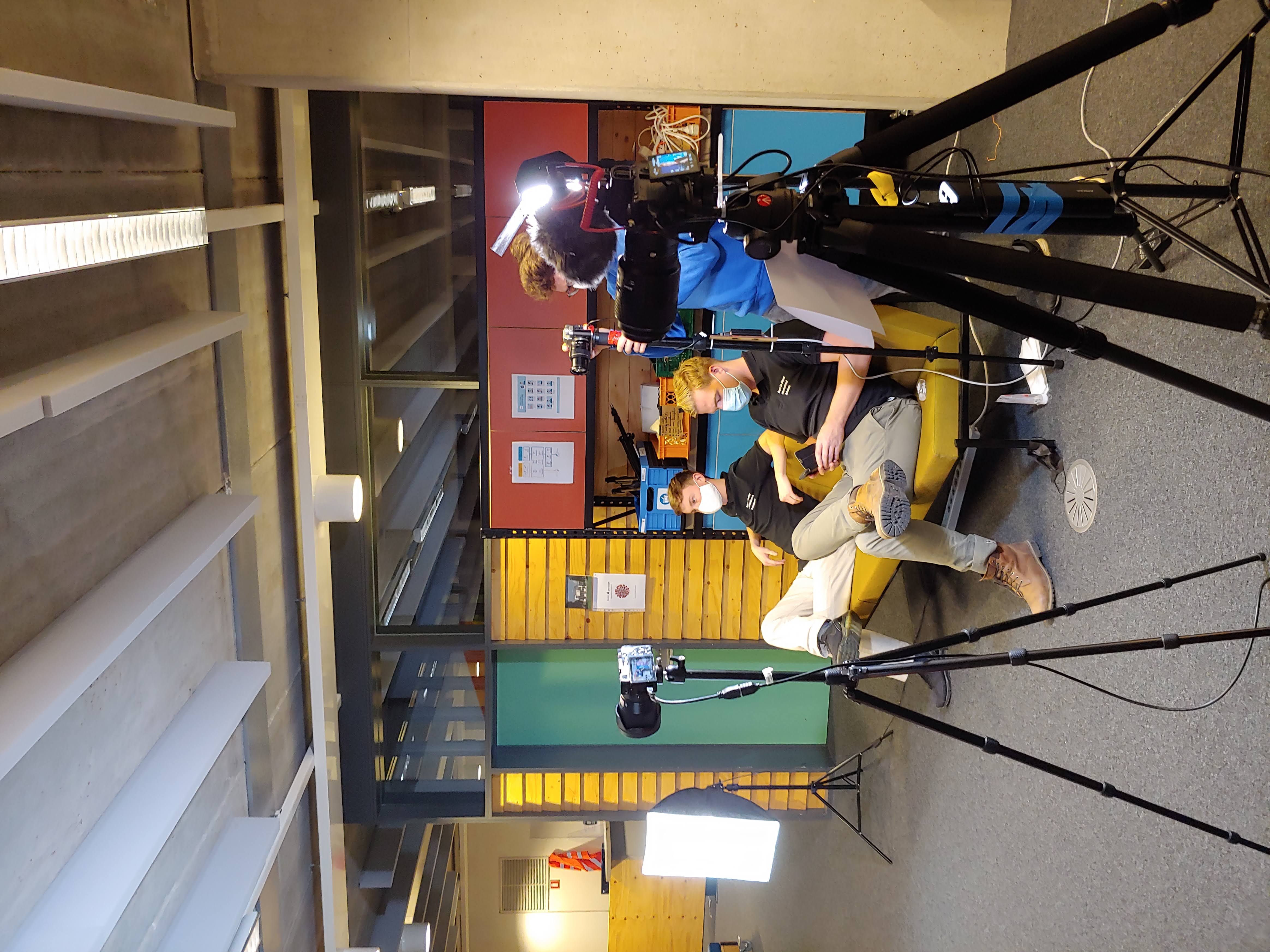 Cameras, lights, and operators preparing an early Broadkastr production
