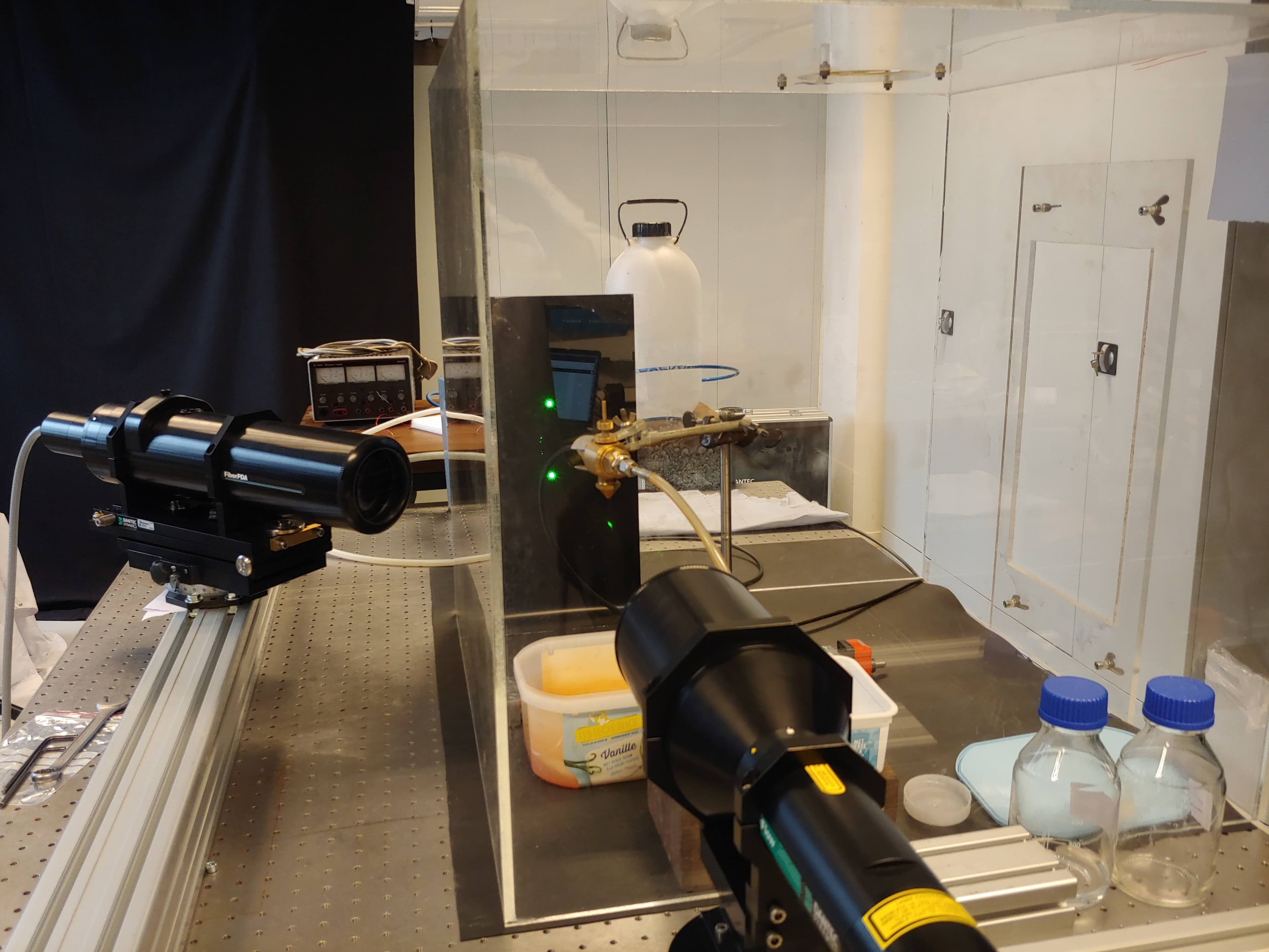 Close view of the optical spray measurement equipment and enclosed pneumatic nozzle